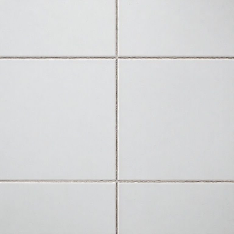 Revestimentos lisos e sem textura em banheiro minimalista.